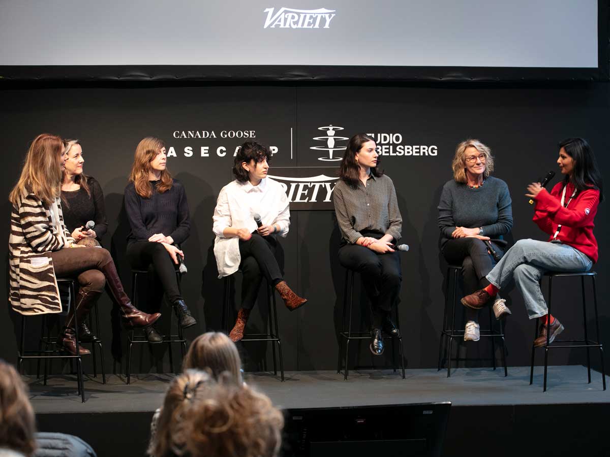 art of film conference canada goose six people sitting chairs black backgorund