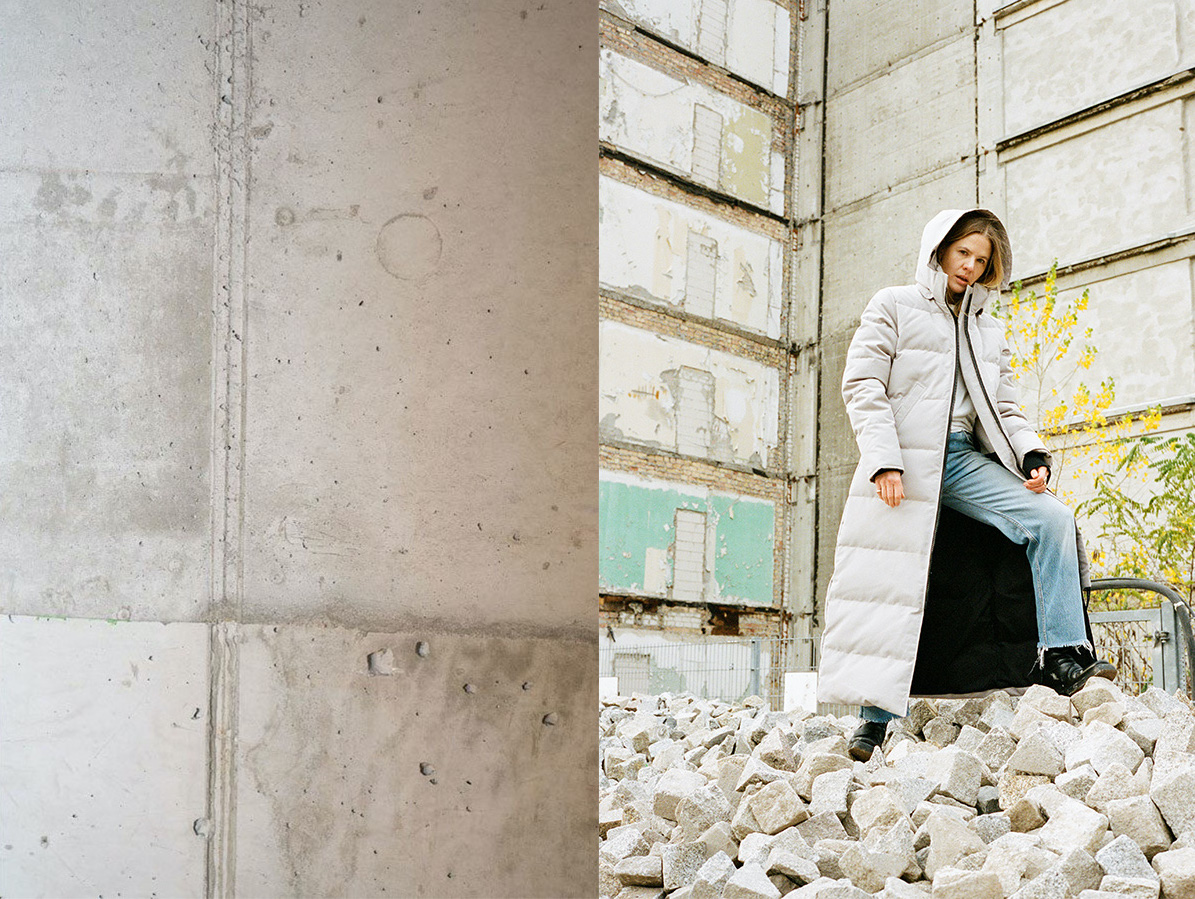 Canada Goose Editorial white puffer coat whitw wall bricks blue jeans