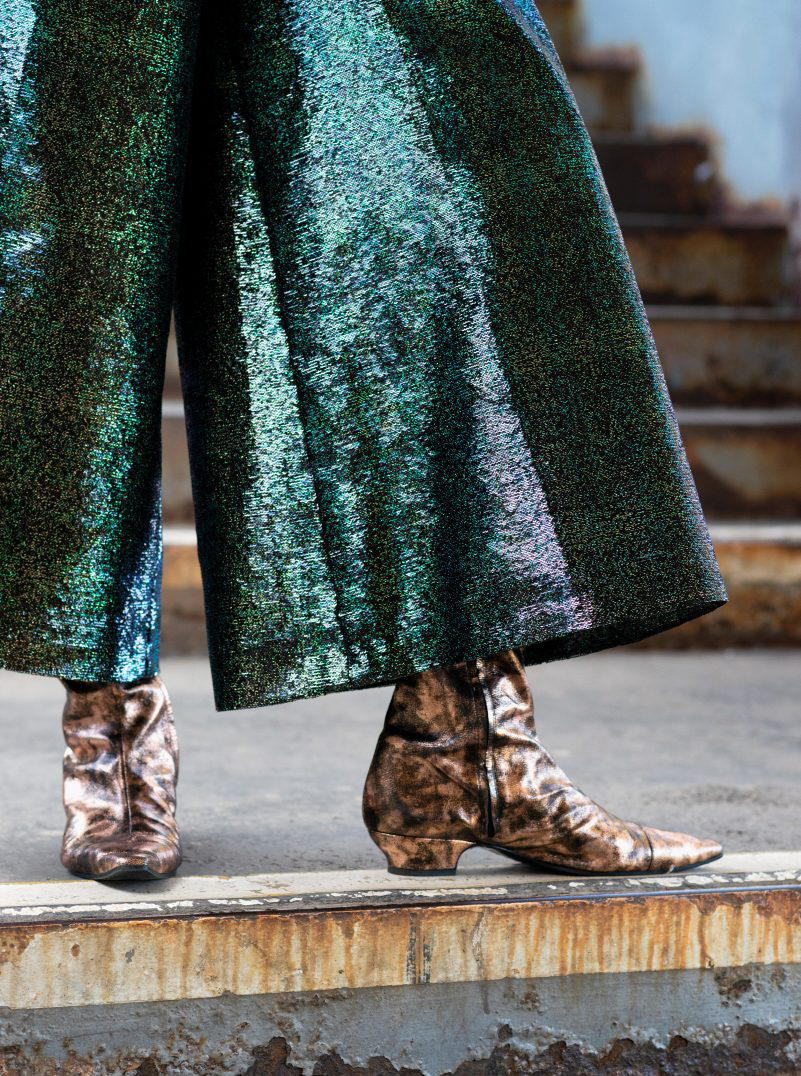 Chanel gold top green pants cowboy boots bronze