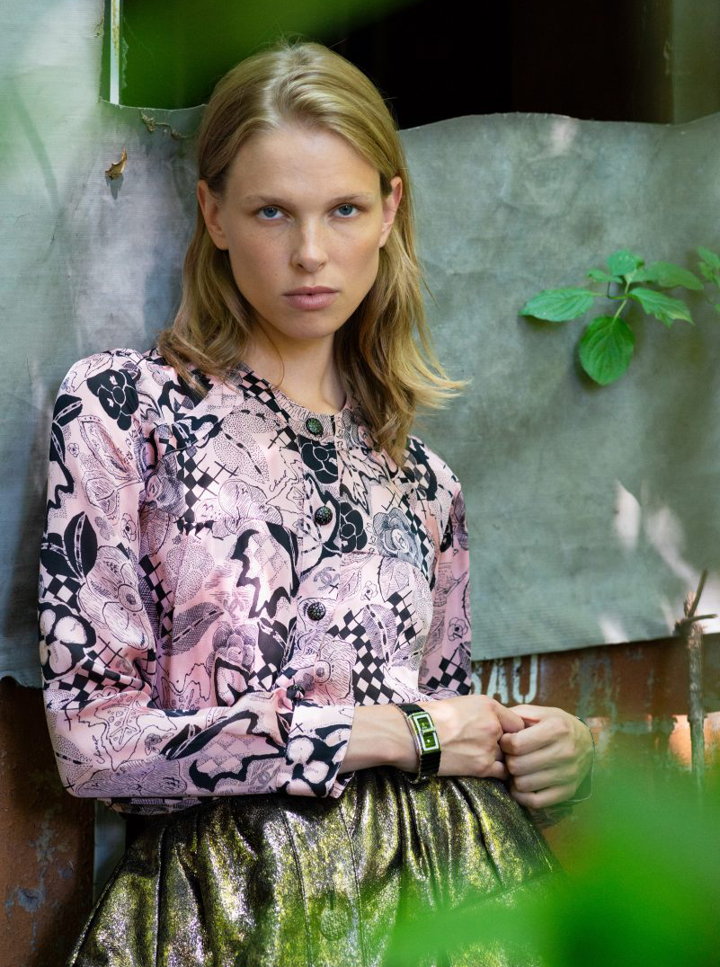 Chanel model blonde green pink top gold skirt