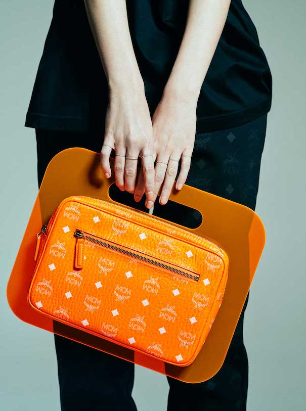 mcm bag orange model hands