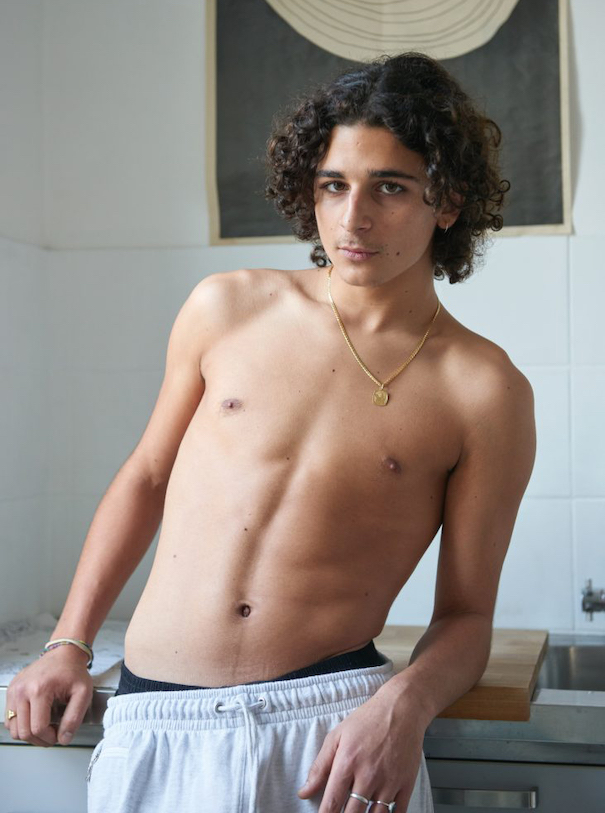 Kira Bunse Tour de France Model Apartment Photography no shirt brown curly hair grey sweatpants