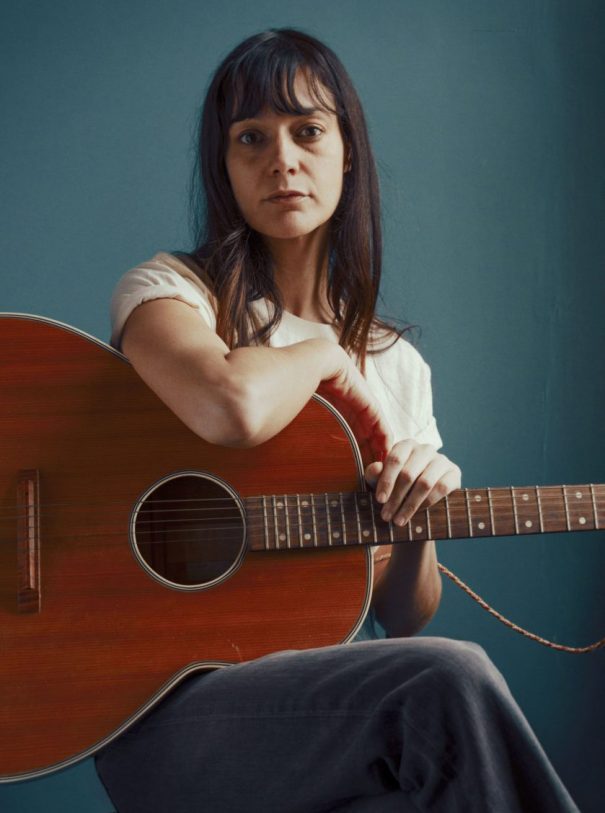 levis vintage woman guitar red blue brown hair white shirt