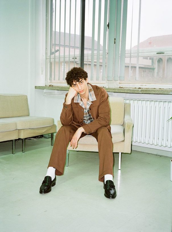 Sissi Goetze Brown Suit Campaign Model sitting office