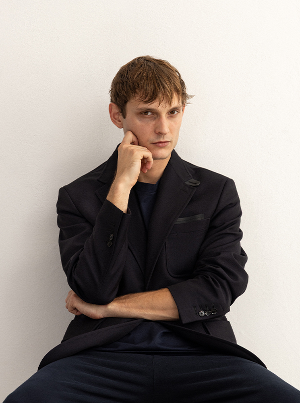 Vincent Schneider/Viva Models is wearing travel jacket and T-shirt BRIONI