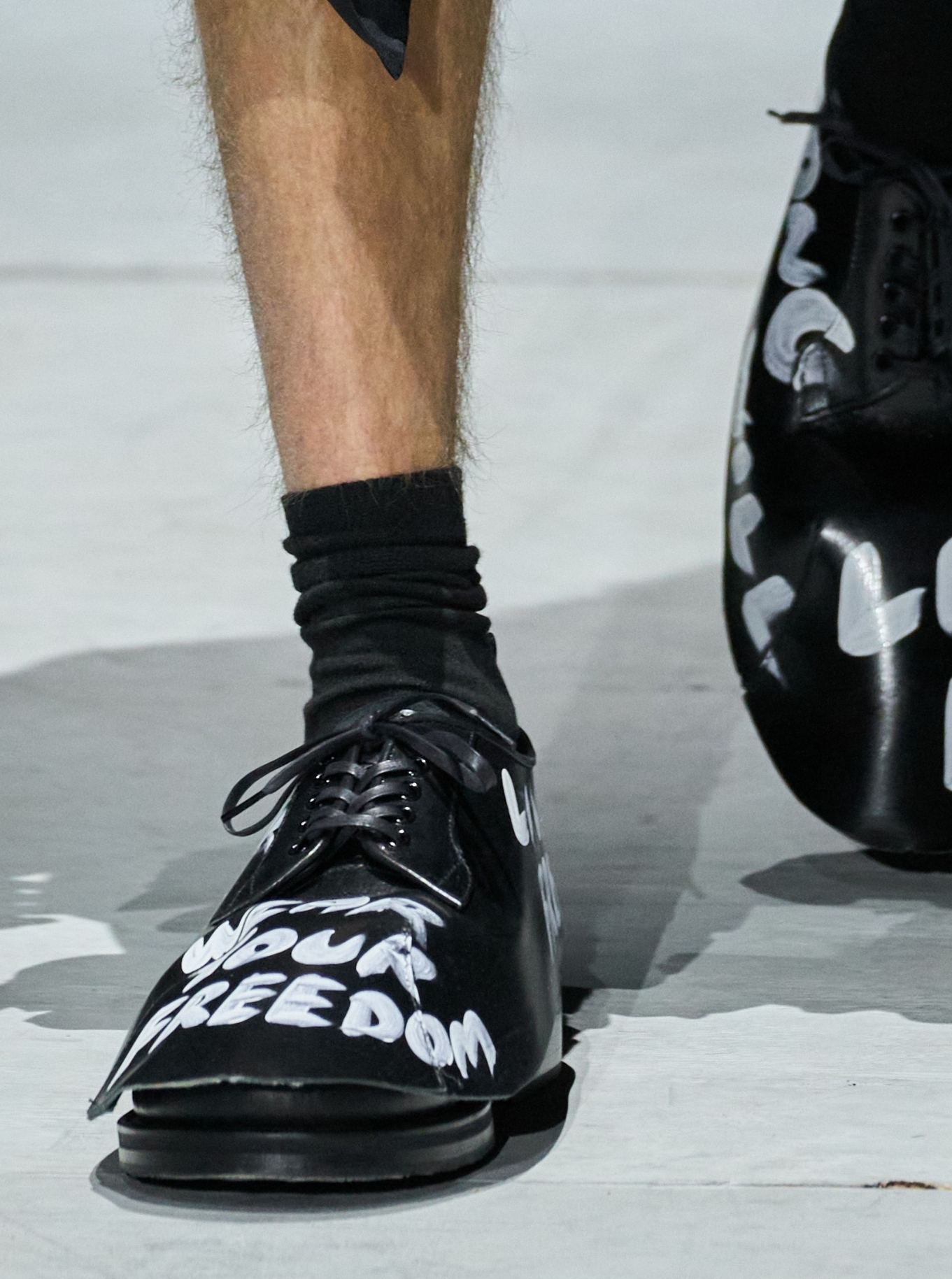 Comme des Garçons Homme Plus F/W 2026 shoes with slogans