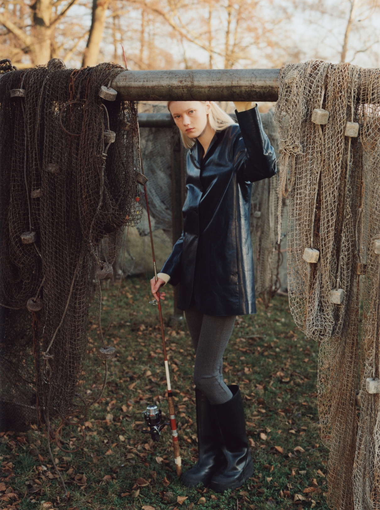 Malin Rudnick wearing a jacket and pants by Jil Sander and boots by Ottolinger