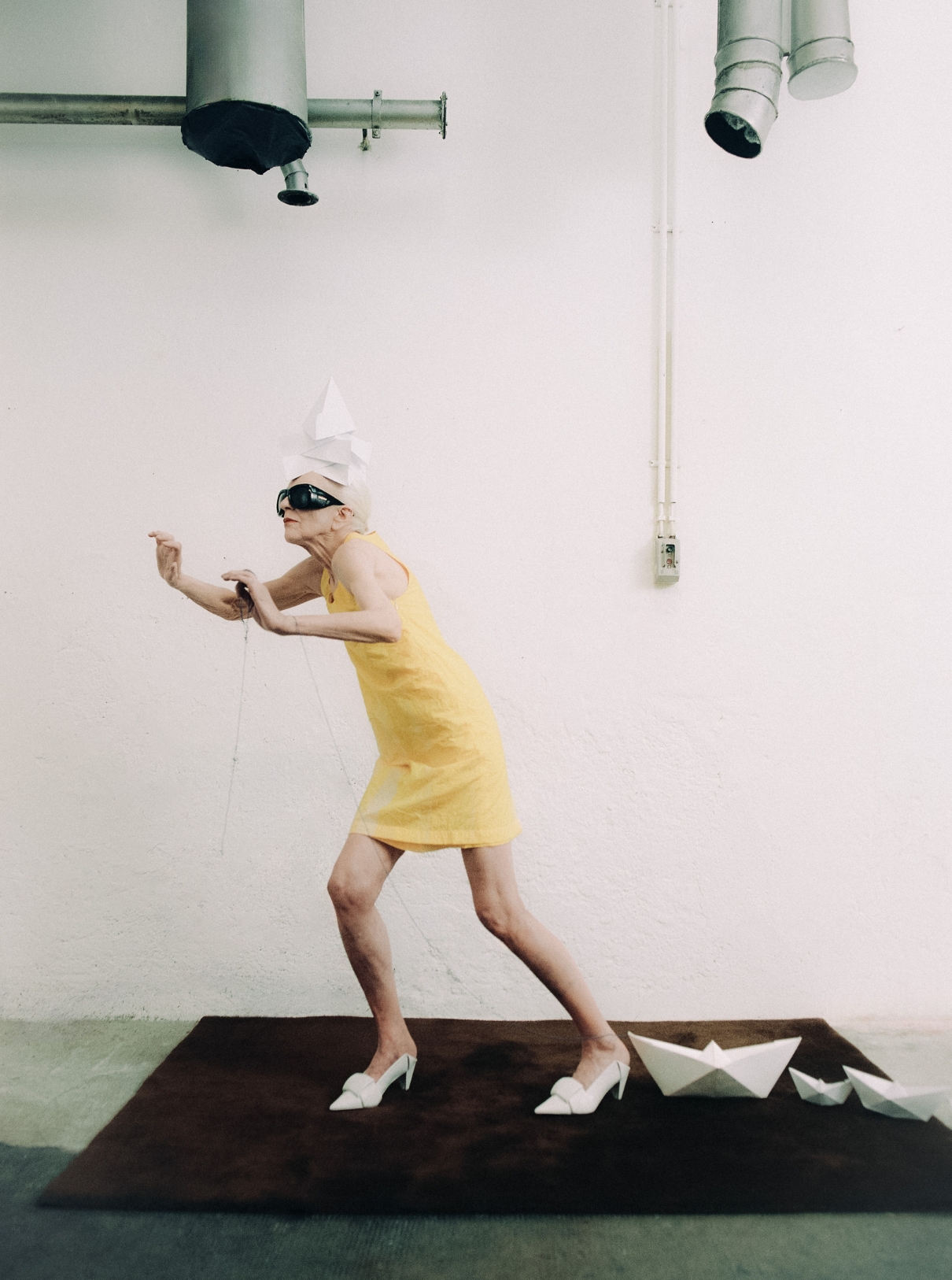 Dress and shoes LOEWE; Sunglasses SAINT LAURENT