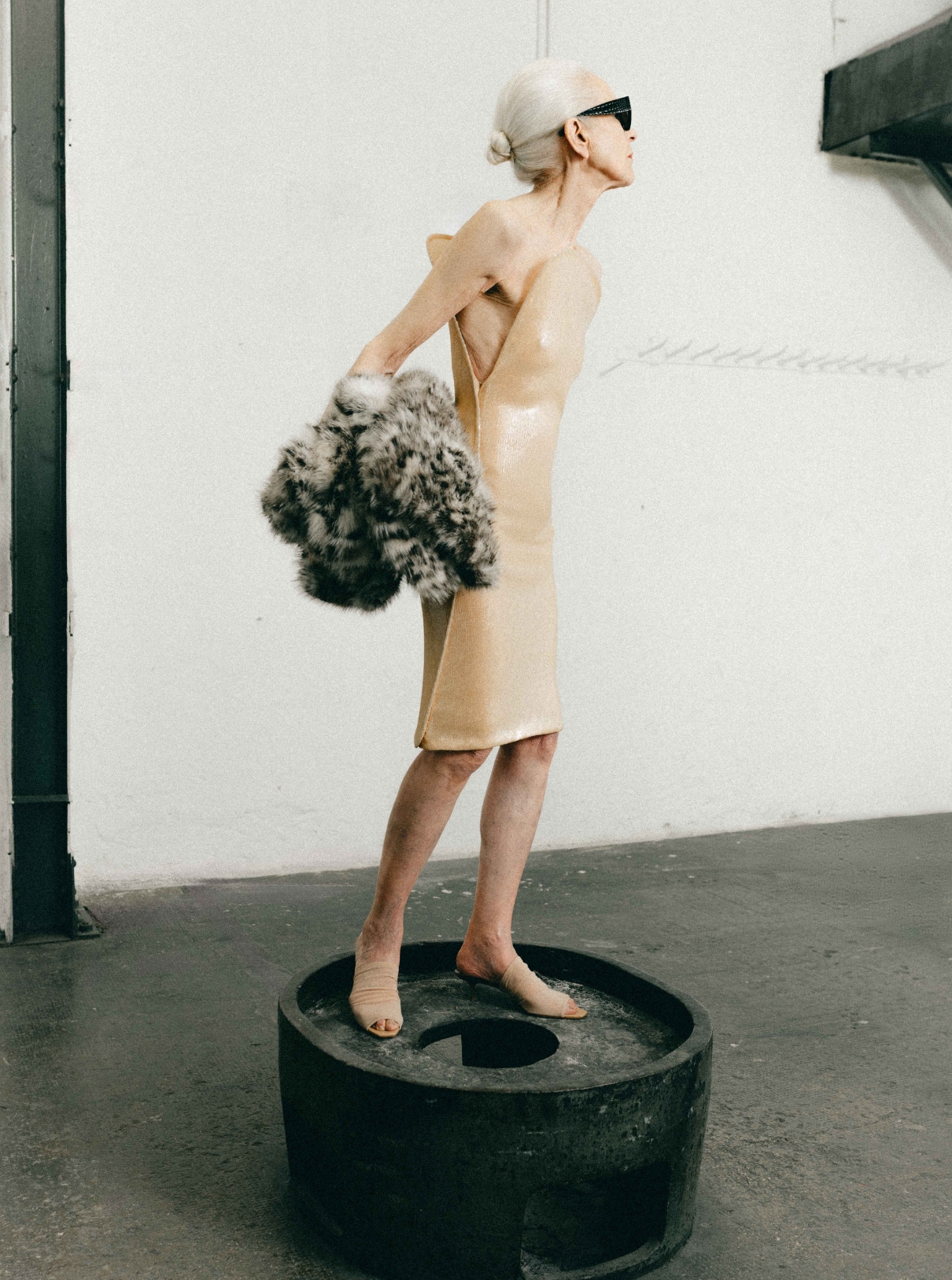 Dress and shoes COURRÈGES; Jacket ISABEL MARANT; Glasses ALAÏA
