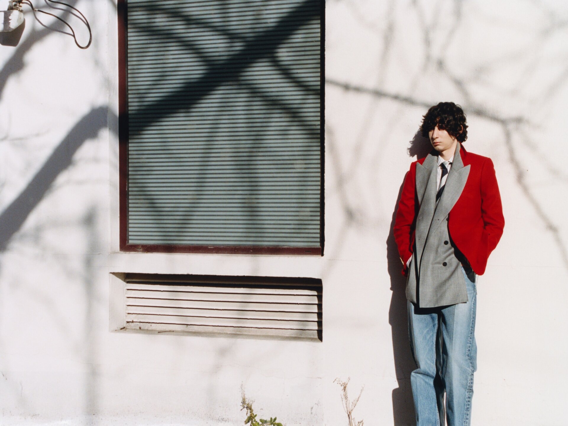 Male model behind the scenes taking a break between shooting for ACHTUNG 51: Das Model